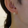 Pendientes con hebilla de oreja de copo de nieve de diseño de nicho para mujer, de alta gama, con sentido pequeño y exquisito, de temperamento, nuevos pendientes de moda al por mayor