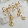 Pendientes Cruzados Transfronterizos Europeos y Americanos Dulces Frescos de Diamantes con Lazo y Borlas Estilo Ins para Mujer Cadena Metálica Colgante con Forma de Corazón