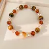 Pulsera de cuentas de ojo de tigre, sensación de lujo ligero de nicho de alta gama, accesorio de mano versátil estilo Maillard