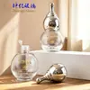 En stock Botella de vidrio de calabaza doble esférica de 10 ml con tapón interior para aceite esencial, subdivisión para suero, perfume, loción, botella cosmética vacía