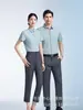 Camisas Grises con Logo Personalizado para Hombre y Mujer Primavera/Verano 2026 Sin Planchar Ligeramente Elásticas Camisas Profesionales Venta de Negocios Ropa de Trabajo