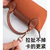 Venta al por mayor transfronteriza adecuada para la transformación de la correa de hombro para bolso mini Longxiang, correa para bolso bandolera sin perforaciones, correa para bolso mini tipo dumpling