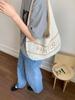 Bolsa de Palha Tecida para Mulheres 2025 Verão Novo Estilo Design Vazado para Brincadeiras na Praia e Roupas de Trabalho Bolsa de Ombro/Axila de Tricô