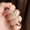 Nuevo brazalete tejido de peces koi verde translúcido estilo chino, moderno, exquisito, fresco y versátil para el uso diario.
