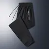 Calças Pretas de Secagem Rápida no Atacado, Calças de Seda Gelada, Calças Casuais Finas de Verão, Calças Esportivas Largas Elásticas de Jogger, Tamanho Grande