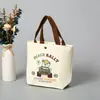 Bolsa de Lona con Oso Estilo Nuevo 2025 Bolsa Portátil para Almuerzo Bolso de Mano Artístico de Dibujos Animados Lindos Bolsa de Regalo para Mujeres