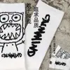 Meias Masculinas e Femininas em Tendência Cano Alto Desenho Animado Deviruchi Cano Longo Casais Algodão Esportes Rua Skate Basquete Meias
