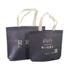 Bolsa de ropa no tejida con nombre de tienda impreso bolsa no tejida recubierta con LOGOTIPO impreso bolsa de protección ambiental publicitaria banco educación