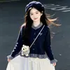 Conjunto de falda para niña 2026 nuevo estilo, con un top de punto tipo dos piezas y una falda plisada, perfecto para primavera y otoño, con un estilo preppy y colegial