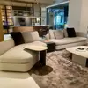 Sofá minimalista italiano estilo crema, tapicería de tela para espacios pequeños, sofá curvo de esquina Ermann para sala de estar y dormitorio
