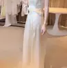 Traje Elegante Casual de Alta Gama Francés para Mujer Tops de Manga Corta Pantalones de Pierna Ancha Conjunto de Dos Piezas Ropa Nueva de Verano para Mujer 2025