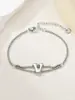 Nuevo Anillo de Acero Inoxidable al por Mayor Transfronterizo 26 Letras Inglesas Anillo de Doble Capa Pulsera Chapada en Oro