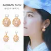 Estilo Ins Coreano Personalidad Moda Fresco Doble Uso Hueco Nido de Pájaro Metal Geométrico Tejido Envuelto Pendientes de Perla para Mujeres