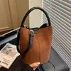 Bolso bandolera de nicho transfronterizo 2026 nueva moda bolso de mano simple bolso cubo bolso de hombro para ir al trabajo bolso versátil para madre e hija