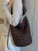 Bolso de mano tejido a mano de rafia estilo coreano de nicho para mujer 2026 Nuevo estilo de vacaciones de verano Bolso de axila de playa
