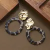 Pendientes de leopardo con forma de anillo geométrico exagerado de moda transfronteriza con un tacto de alta gama y lujoso que acentúa los rasgos faciales y hace que el rostro parezca más delgado