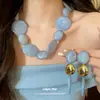 Conjunto de collar y aretes de cuentas redondas acrílicas transfronterizo europeo y americano, accesorios de moda para el día a día con diseño versátil