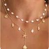 Colar com Pingente de Estrela do Mar e Concha do Mar em Aço Inoxidável Estilo Praia Oceânica Europeu e Americano Colar de Pérolas Feminino Colar com Design