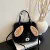 Bolsa de mão de desenho animado transfronteiriça para mulheres, novo estilo outono 2026, bolsa de ombro e transversal de pelúcia de nicho, moderna e versátil para meninas