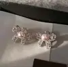 Brincos de Tarraxa Princesa do Mar com Laço Iridescente Pérola e Zircônia Herdeira de Família Rica Moda Temperamento Doce Brincos de Laço para Mulheres