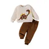 Conjunto de franela para niños de comercio exterior transfronterizo otoño e invierno, con un diseño de bordado de dinosaurio de dibujos animados, que consta de una sudadera de manga larga y pantalones largos, un conjunto de dos piezas para niños