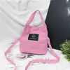 Atacado Primavera e Verão Nova Mochila de Lona Feminina Bolsa de Mão Bolsa Transversal de Ombro Cor Doce Porta-moedas para Celular