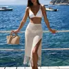 Nuevo producto transfronterizo de moda europea y americana: falda sexy texturizada con abertura alta y flecos, falda para cubrir bikini de vacaciones en la playa