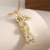 Colar Pingente Aogu Cruz Religiosa Transfronteiriça Banhado a Cobre Ouro 18K Incrustado com Zircônia Deus da Morte Sacerdote para Mulheres Colar Personalizado Novo