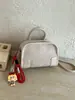 Bolsa pequena estruturada com padrão trançado para mulheres, nova bolsa quadrada pequena casual 2026, bolsa transversal de mão para o verão de alta qualidade para o trabalho
