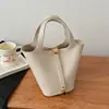 Bolso Pequeño Exquisito Transfronterizo para Mujer 2026 Nuevo Súper Popular Bolso Cubo Simple para el Trabajo Estilo Coreano Casual Bolso Cruzado