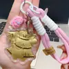 Llavero Dorado Perro Pudín Dibujo Animado Oro Puro 999 Correa para Teléfono Móvil Colgante para Bolso Atractivo para Clientes Regalo Venta al por Mayor
