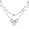 Collar apilado de doble capa con colgante de corazón hueco dorado de nuevo estilo transfronterizo europeo y americano 2025 Joyería de moda de nicho