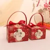 Caja de Dulces para Boda 2026 Nuevo Modelo Estilo Chino Portátil Caja de Regalo de Dulces para Boda Bolsa de Dulces para Boda de Gama Alta Nicho Caja de Regalo