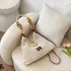 Bolsa de Palha Trançada para Férias na Praia para Mulheres 2026 Novo Estilo Bolsa de Mão de Tricô Vazado Grande Capacidade Bolsa de Ombro/Axila