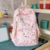 Mochila escolar fresca e fofa para meninas, estampa de estrelas de desenho animado estilo Ins, mochila de grande capacidade para alunos do ensino fundamental, projetada para reduzir a carga e proteger a coluna vertebral
