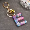 Venta caliente transfronteriza de moda 26 letras inglesas colgante de llave llavero de resina colgante creativo para bolsa de pareja