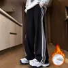 Pantalones a rayas rectos holgados versátiles de moda para hombre al por mayor de fábrica para otoño, pantalones deportivos juveniles para hombre