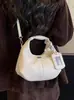 Yaozi 2026 otoño temprano nueva moda versátil casual simple bolso de hombro con textura retro, adecuado para ir al trabajo, se puede llevar en la mano o cruzar.