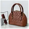 Popular bolsa de concha 2026, nuevo bolso de hombro de moda, bolso de mujer para el trabajo, bolso floral de bordado de hueso para teléfono móvil, bolso cruzado para mujer