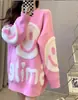 Nuevo suéter de punto para mujer estilo coreano otoño e invierno, cuello redondo, cara sonriente bordada con letras, color de contraste, estilo holgazán, manga larga