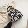 La bolsa popular de este año 2023 nueva moda en línea popular bolsa tote para mujer gran capacidad Bolso de hombro de lona para mujer
