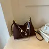 Bolsa de mão estilo doce popular este ano, bolsa pequena quadrada, bolsa feminina, nova chegada de verão 2026, bolsa de ombro única de cor sólida, bolsa transversal moderna