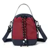 Bolso cruzado de color bloqueado para exteriores, Mochila pequeña multifuncional, Bolso para botella de agua de doble uso de alta apariencia, Bolso de hombro para senderismo y montañismo