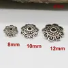 Plata del Tíbet aleación retro flor de toro tapa flor de toro oro antiguo plata del Tíbet toro accesorios para joyería DIY al por mayor