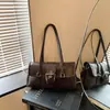 Bolso de Mano de Nicho Estilo Coreano de Moda Otoño/Invierno 2026 Nuevo Dulce Fresco Chica Picante Bolso de Motocicleta Bolso Retro Americano para Mujer