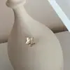 Botón metálico decorativo estilo Chanel combinación estrella luna camisa suéter tejido cárdigan gemelos hebilla de cuello hebilla de ropa