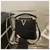 Moda 2025 Nuevo Bolso de Mano con Bloques de Color para Viajes Cotidianos Textura Simple de Hombro Único Cruzado Cubo Mini Bolso para Mujer de Moda