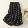 Tiro real Invierno retro elástico lana cuadros midi falda empalmada floral botón esponjoso línea A falda