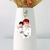 Nuevo llavero acrílico blanco de doble cara, colgante para mochila, soporte para abanico, mercancía de Zhang Yixing, mismo estilo que se ve en Douyin