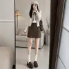 Saia curta de lã estilo coreano para mulheres, novo modelo outono e inverno 2026, cintura alta, modeladora, petite, saia lápis A-line de terno cinza